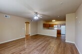 Located at 14086 Airline Hwy in Gonzales, Louisiana, this single-story, 3-bedroom, 2-bathroom home offers a well-organized and functional layout. The open kitchen is equipped with abundant warm wood cabinetry, granite-style countertops, and white appliances including a range, microwave, and refrigerator, all set on wood-look plank flooring. The living area flows naturally and features a distinctive arched doorway leading to the bathroom, adding a subtle architectural detail. Neutral-toned walls and durable wood-look flooring extend throughout the main living spaces, creating a clean and cohesive aesthetic. The generously sized primary bedroom features plush carpeting, a ceiling fan, and a closet, providing a comfortable retreat. The additional bedrooms are also carpeted and receive natural light through windows with blinds. Both bathrooms are finished with tile flooring, warm wood vanity cabinetry, granite-style countertops, and full tub-shower combinations. The second bathroom also features a tiled soaking tub. A dedicated laundry room with washer hookups adds everyday convenience. The home is rounded out by two hallways, an entrance, and a closet, ensuring ample storage and easy navigation throughout.