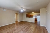 Located at 14086 Airline Hwy in Gonzales, Louisiana, this single-story, 3-bedroom, 2-bathroom home offers a well-organized and functional layout. The open kitchen is equipped with abundant warm wood cabinetry, granite-style countertops, and white appliances including a range, microwave, and refrigerator, all set on wood-look plank flooring. The living area flows naturally and features a distinctive arched doorway leading to the bathroom, adding a subtle architectural detail. Neutral-toned walls and durable wood-look flooring extend throughout the main living spaces, creating a clean and cohesive aesthetic. The generously sized primary bedroom features plush carpeting, a ceiling fan, and a closet, providing a comfortable retreat. The additional bedrooms are also carpeted and receive natural light through windows with blinds. Both bathrooms are finished with tile flooring, warm wood vanity cabinetry, granite-style countertops, and full tub-shower combinations. The second bathroom also features a tiled soaking tub. A dedicated laundry room with washer hookups adds everyday convenience. The home is rounded out by two hallways, an entrance, and a closet, ensuring ample storage and easy navigation throughout.