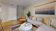 Located at 580 Rohnert Park Expy in Rohnert Park, California, this single-floor residence offers a thoughtfully designed layout with a cohesive, contemporary aesthetic. The living room serves as the heart of the home, featuring crown molding, light wood-style flooring, a ceiling fan, and a sliding glass door that opens to an outdoor balcony, allowing natural light and garden views to fill the space. Adjacent to the living area, a dedicated dining nook provides an intimate setting with recessed framing and convenient access to the main living space. The kitchen is efficiently laid out with white cabinetry, granite-style countertops, stainless steel appliances, and a window that brings in additional natural light. Two bedrooms offer comfortable retreats, each with plush carpeting and windows overlooking greenery. One bedroom features multiple closet doors, providing ample storage. The bathroom is well-appointed with a wide vanity, granite countertops, a large mirror, and wood-style flooring that maintains the home's consistent, clean design language. Neutral warm-toned walls throughout create a calm and welcoming ambiance, tying together each area of this well-organized single-level home.