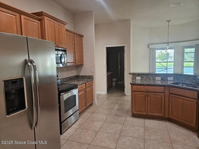 Kitchen with lake view - 2074 Botanica Cir