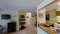 This single-floor residence offers a well-organized and comfortable layout designed for easy living. The living room serves as the central gathering space, featuring plush wall-to-wall carpeting, a textured ceiling, and a large sliding glass door dressed with vertical blinds that invites natural light and provides access to the outdoors. The room comfortably accommodates a full seating arrangement, making it ideal for relaxing or entertaining.

Adjacent to the living area, a hallway connects the various rooms of the home, lined with neutral-toned walls and consistent carpeting that creates a cohesive flow throughout the space. Framed artwork and wall décor add warmth to the transitional areas.

The kitchen is accessible via a pass-through opening featuring a granite-style countertop, allowing for convenient interaction between the kitchen and the adjoining living and dining areas. The layout promotes an open, connected feel without fully removing the distinction between spaces.

Overall, the unit presents a warm and inviting ambiance with its soft neutral color palette, carpeted floors, and functional open design. The consistent use of light tones on the walls and ceilings throughout enhances the sense of openness, making this a comfortable and practical single-level living space.