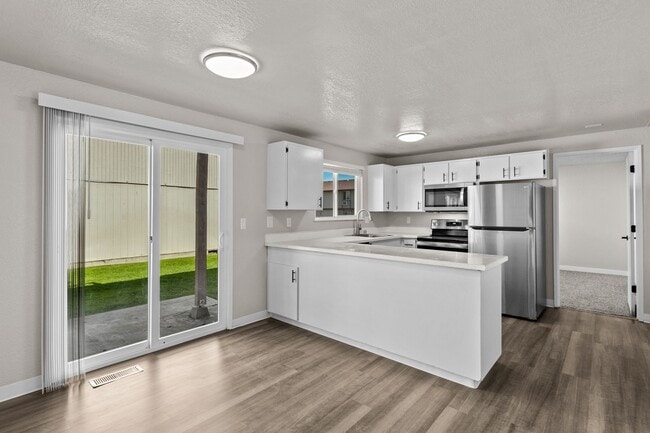 Building Photo - One of the largest 2 bedrooms in the area with 1.5 bathrooms and 1100 square feet plus your own l...