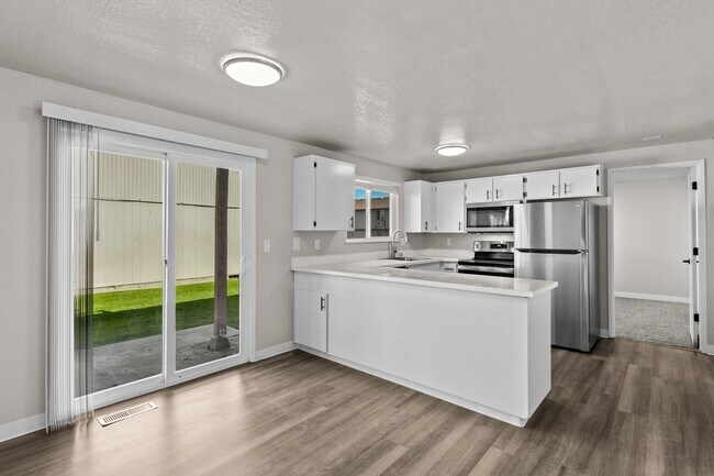 Building Photo - One of the largest 2 bedrooms in the area with 1.5 bathrooms and 1100 square feet plus your own l...