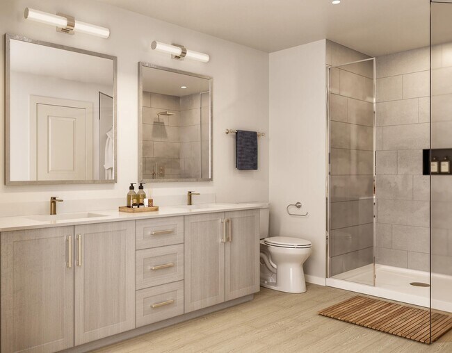 El cuidado diseño de los baños en Modera Walsh Heights combina acabados impecables con una distribución espaciosa para crear un refugio elegante y confortable. - Modera Walsh Heights