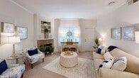 This inviting 1010 square foot apartment in Charleston, SC offers a harmonious blend of comfort and style. The open-concept living area serves as the heart of the home, featuring a brick fireplace, built-in shelving, and large windows that flood the space with natural light. The living room seamlessly connects to a dining area, perfect for entertaining or casual meals.

The kitchen, while not fully visible in the images, appears to have wood cabinetry and modern appliances. Two bedrooms provide ample space for rest and relaxation, with the primary bedroom measuring a generous 180 square feet. Both bathrooms are well-appointed, with one showcasing a bathtub-shower combination and coastal-themed decor.

Throughout the apartment, a cohesive design aesthetic prevails, combining coastal and contemporary elements. Soft, neutral tones are accented with pops of navy blue, creating a calming atmosphere. Thoughtful details such as area rugs, decorative pillows, and carefully chosen artwork contribute to the overall ambiance.

Storage solutions are integrated throughout, including closet space in the bedrooms and hallways. The apartment's layout maximizes the available 1010 square feet, creating a spacious feel despite its modest size. Located at 3590 Mary Ader Ave in Charleston, this property offers a comfortable and stylish living space in a desirable area.