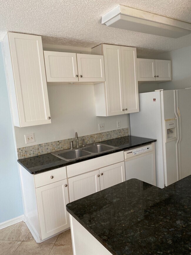 Side-by-side refrigerator with ice and water through the door. Dishwasher has many functions. - 2696 Forest Ridge Dr