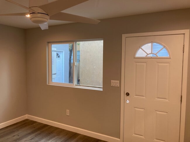 Living roomceiling fan light, recessed lights, hard wood floors - 16021 Victory Blvd