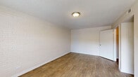 Located at 855 King Arthur Dr in Fayetteville, NC, this single-floor, 3-bedroom, 2-bathroom home offers a practical and comfortable layout. Throughout the living spaces, wood-look flooring provides a warm, cohesive aesthetic, complemented by textured ceilings that add character to each room.

The three bedrooms are bright and well-proportioned. The generously sized primary bedroom offers ample space and connects conveniently to a dedicated closet and bathroom access. A standout feature found in several bedrooms is the painted white brick accent wall, adding a distinctive architectural touch. Natural light filters through blinded windows in each room, and select bedrooms include ceiling fans for added comfort.

The two bathrooms are clean and functional. Each features a vanity with a sink set into a light-toned countertop, dark cabinetted storage beneath, and a large mirror above. One bathroom includes a bathtub/shower combination and connects through to an adjacent room, providing a practical flow. Both bathrooms maintain a bright, neutral palette with white walls.

A hallway connects the rooms efficiently, and a dedicated closet provides additional storage. The home's straightforward single-floor design makes it easy to navigate, while its neutral tones and consistent flooring throughout create a unified and move-in ready environment.