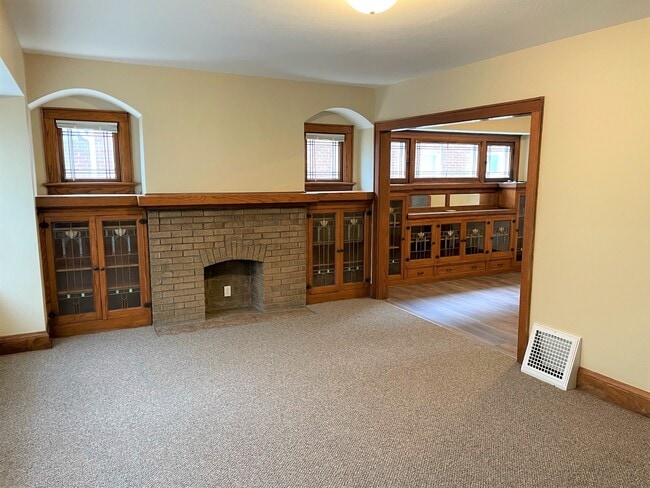 Living room with new paint and carpet - 2745 N 54th St