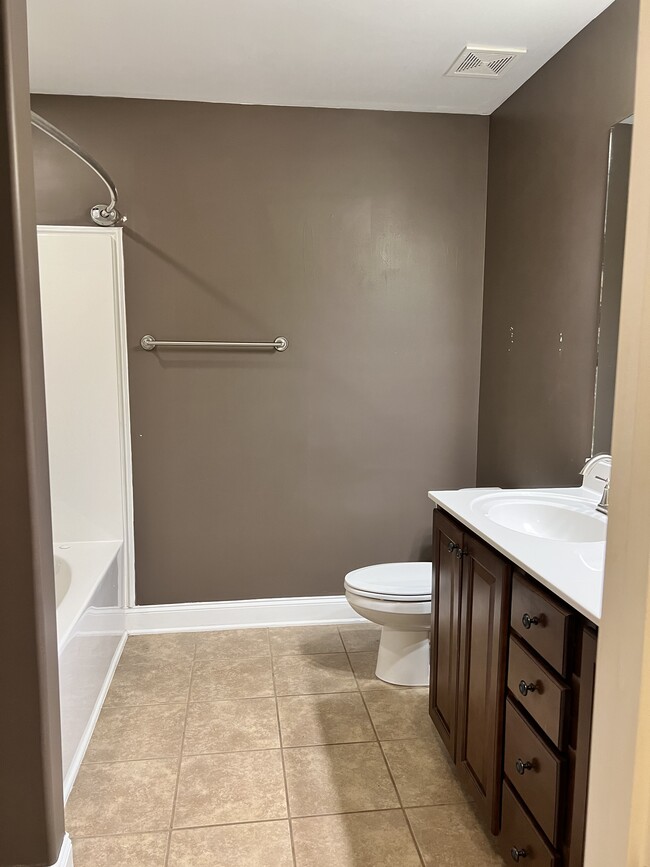 Primary bathroom with double sinks and garden tub and shower - 253 Village Springs Dr