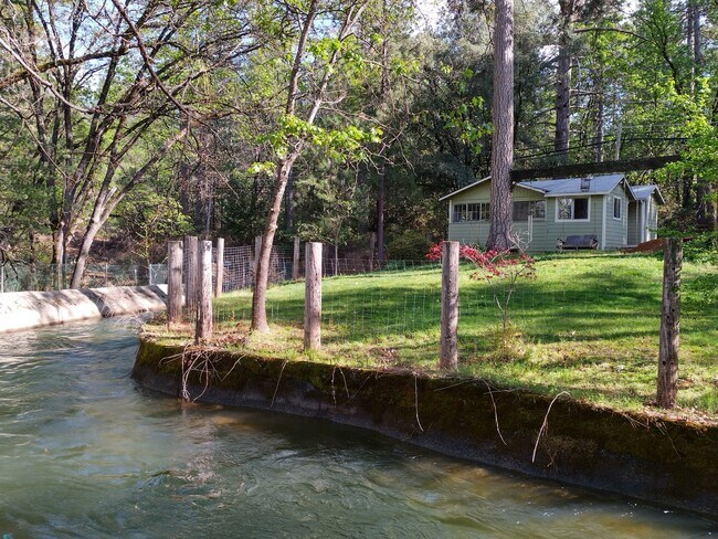 Property is surrounded by a beautiful NID Canal. 0.75 acre property. - 16430 Canal Rd
