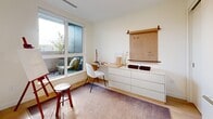This thoughtfully designed three-bedroom, two-bathroom unit in Vancouver's Fraser neighbourhood offers a practical and contemporary living environment across a single floor. The open-concept kitchen is a standout feature, outfitted with full-height flat-panel cabinetry in a warm off-white finish, stainless steel appliances including a built-in oven and integrated dishwasher, and a clean white countertop that extends to a generous workspace. It flows naturally into the dining area, anchored by a round wood table that adds warmth to the bright, neutral palette. Light hardwood flooring runs throughout the main living areas, complementing the crisp white walls and recessed lighting. The welcoming hallway entry includes in-unit stacked laundry for added convenience. The primary bedroom is a calm retreat with light hardwood floors and wall-mounted lighting. A second bedroom doubles effectively as a home office, featuring a built-in desk, dresser, and a large window overlooking the balcony. The compact third bedroom captures natural light through its own window. Both bathrooms are finished with large-format tile, soaker tubs, and wood-toned vanities. The balcony provides outdoor access, rounding out a well-appointed and efficiently laid-out urban home.