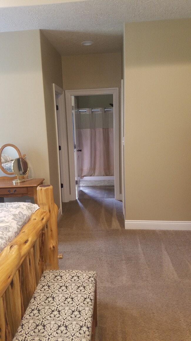 Looking from master bed into master bath - walk in closets on both sides - 1235 Harmony Lane