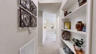 Located in Tulsa, Oklahoma, this well-appointed single-story home offers two bedrooms, two bathrooms, and a functional layout designed for comfortable everyday living. Crown molding is a consistent architectural detail throughout, lending a polished, cohesive feel to each room.

The kitchen is a standout feature, designed in a galley style with dark espresso cabinetry, light countertops, tile flooring, and a full suite of appliances including a refrigerator, range, and dishwasher. It opens directly to the dining area, which is anchored by a pendant chandelier and flows naturally into the living room — an arrangement that supports easy entertaining and daily routines.

The living room receives generous natural light through large windows dressed with layered curtains, and features soft carpet throughout. The primary bedroom is notably spacious, also carpeted, and includes a ceiling fan and ample room for large furnishings. The second bedroom offers similar comfort and natural light.

Both bathrooms are finished with tile flooring and vanities with storage. One bathroom features a soaking tub, while the other includes a shower-tub combination. Each has a linen closet nearby for added convenience.

A dedicated in-unit laundry room with full-size washer and dryer hookups and wire shelving provides practical storage. Two additional closets round out the storage options throughout this well-organized home.