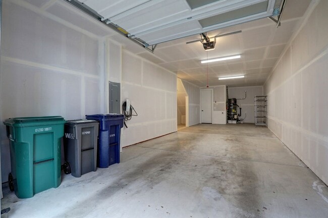 Building Photo - Live Where Style Meets Convenience – 2BR Townhome + Garage