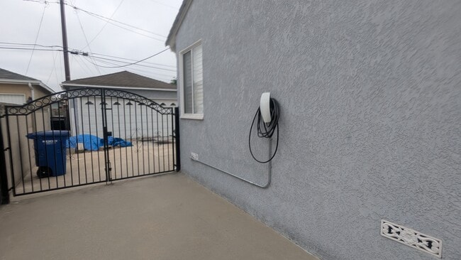 Driveway with Tesla charger - 5732 Yearling St