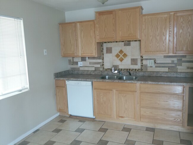 Building Photo - For Rent in Youngtown. Upgraded Kitchen, Tile, Carpet, Covered Parking, Single Level