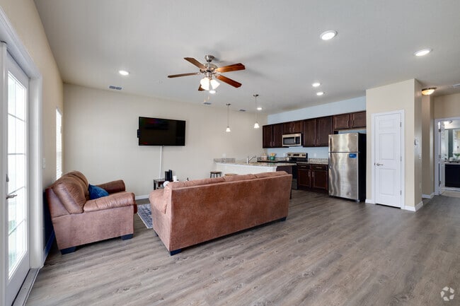 4BR, 4BA - 1,772SF - Living Room, Kitchen - Melbourne Commons