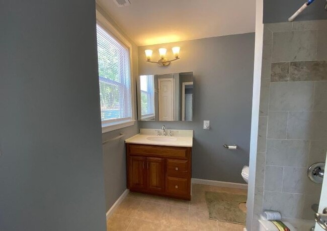 Notice the nicely tiled bath/shower - 26 W Center St