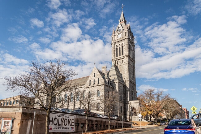 City Hall is a large stone structure in the Gothic Revival style.