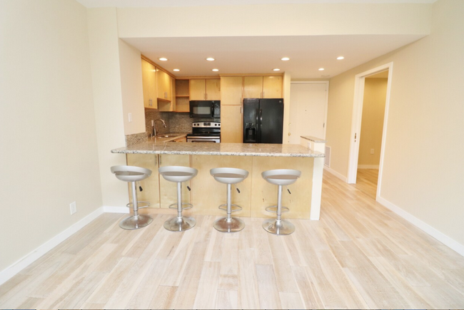 kitchen with counter bar - 969 Hilgard Ave