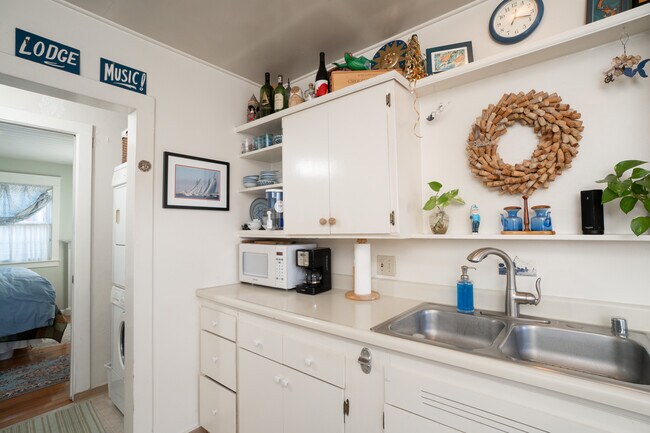 kitchen into laundry and bedroom - 1188 Harcourt Ave