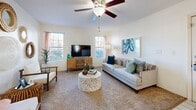 Located at 345 Shadow Mountain Dr in El Paso, TX, this 2-bedroom, 1-bathroom residence offers a thoughtfully organized single-floor layout. The living room serves as the heart of the home, featuring plush carpet, a ceiling fan with light fixture, a textured ceiling, and multiple windows that allow abundant natural light to fill the space with a warm, inviting ambiance.

The galley-style kitchen is efficiently designed with cream cabinetry, light marble-finish countertops, hardwood-style flooring, and a full suite of stainless steel appliances including a range, microwave, refrigerator, and dishwasher. Adjacent to the kitchen is a dedicated dining area, completing the shared living and entertaining zone.

The primary bedroom is a comfortable retreat featuring carpet flooring, a sliding glass door that brings in natural light and outdoor views, and a barn-style headboard accent. Both bedrooms include closets for ample storage. The shared bathroom features hardwood-style flooring, a vanity with generous counter space, and a full shower-tub combination.

Throughout the residence, bright white walls and neutral tones create a clean, cohesive aesthetic. With two closets and a functional floor plan, this home provides practical everyday comfort in a residential El Paso neighborhood.