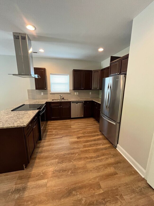 Building Photo - 4 BR | 2.5 BA | Townhome Close to Volkswagen, Amazon & Fed Ex