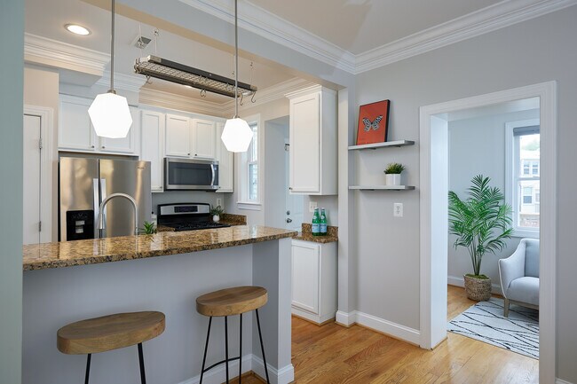 Granite kitchen counter tops, stainless steel appliances including gas stove and dishwasher. - 4606 Iowa Ave NW