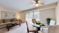 Located at 27367 Detroit Rd in Westlake, Ohio, this one-bedroom, one-bathroom residence offers a thoughtfully laid-out single-floor plan. The combined living and dining area serves as the heart of the home, featuring plush wall-to-wall carpeting, a textured ceiling with a ceiling fan, and a large sliding glass door dressed with vertical blinds that floods the space with natural light and provides views of the outdoor area. The dining space is defined by wainscoting along the walls, adding a classic architectural touch.

The kitchen is functionally designed with warm oak cabinetry, granite-toned laminate countertops, a stainless steel sink, and white appliances including a refrigerator and dishwasher, set on durable tile flooring. A connecting hallway leads seamlessly to the private bedroom, which is generously sized with soft carpeting, a textured ceiling, and a window with blinds that invites natural light.

The full bathroom features tile flooring, a vanity with wood cabinetry, and a shower-tub combination. Throughout the residence, neutral tones and consistent finishes create a cohesive, comfortable ambiance well-suited for everyday living in the Westlake community.
