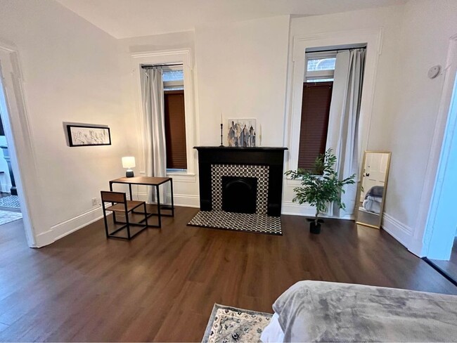 Bedroom with blackout curtains - 124 N Clay St