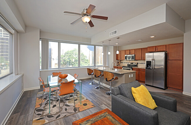 Updated Model Suite with All New LVT Hard Surface Flooring - Living Area - Residences at 1717