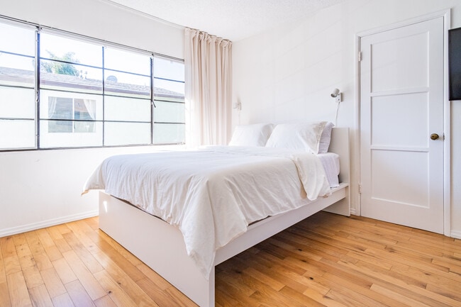 2 sets of shades. One set blackout shades. One set sheer panel shades - 1637 Cortez St