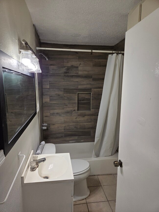 Updated Shower with floor to ceiling ceramic tiles. - 132 Westerfield St
