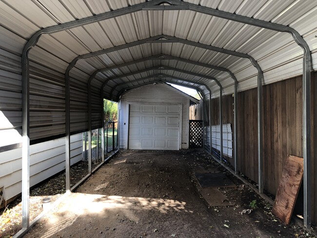 Gated carport with garage workshop - 2833 NW 15th st