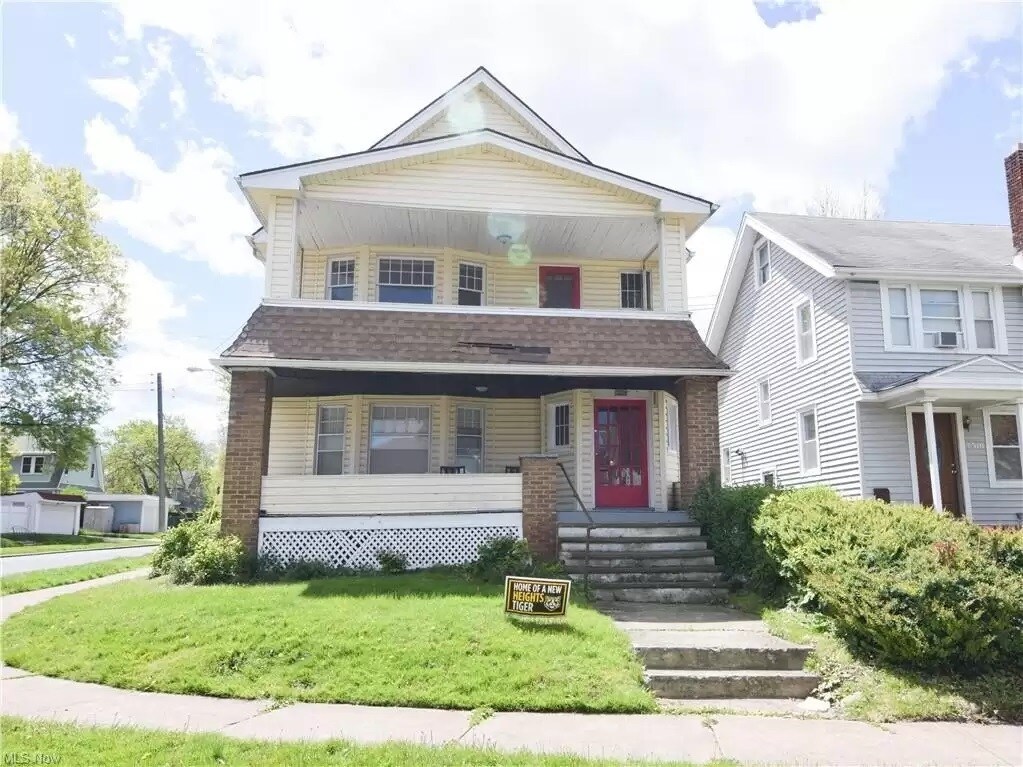 The property offers a front and rear yard, a second floor balcony, and dedicated garage parking - 3320 Berkeley Rd
