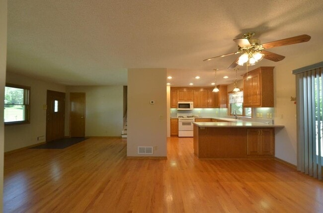 open concept layout in kitchen, dining room and formal living space - 6117 Tracy Ave