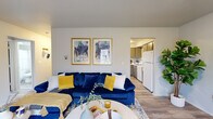 This single-floor residence at 714 Kelford Pl in Trotwood, Ohio offers a thoughtfully arranged layout comprising a living room, combined dining area and kitchen, one bedroom, one bathroom, and a connecting hallway. The living room serves as the heart of the home, featuring light wood-style flooring, neutral walls, and a large window that draws in natural light and provides outdoor views of the surrounding greenery. The open sightline to the kitchen enhances the sense of space throughout the main living area.

The kitchen is efficiently designed with gray cabinetry, white laminate countertops, a stainless steel sink, and white appliances including a dishwasher and refrigerator. Adjacent to the kitchen, the dedicated dining area accommodates a table and chairs comfortably with its own defined space and wood-style flooring.

The generously sized primary bedroom features plush carpet, a large window with a built-in ledge, and a walk-in closet, providing ample storage. The room receives good natural light and offers a quiet, comfortable retreat.

The bathroom is clean and functional, featuring a vanity with a speckled countertop, a large mirror, and a shower-tub combination. The hallway connects all areas efficiently, completing this well-organized and move-in-ready home.