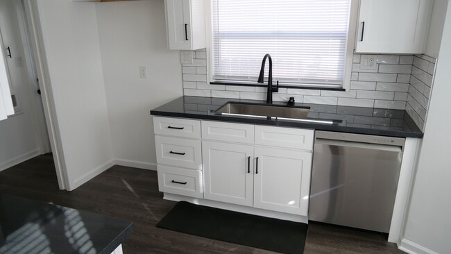 Modern kitchen. New cabinetry, countertop and tile. Large single stainless sink and LG dishwasher. - 259 E Puente St