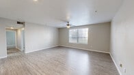 Located at 9465 Clearwood St in Houston, TX, this single-story, 4-bedroom, 2-bathroom home offers a practical and well-organized floor plan. The combined living and dining area serves as the heart of the home, featuring light wood-style hard-surface flooring, a ceiling fan with light fixture, and a window that brings in natural light, creating a bright and airy atmosphere. The kitchen is designed with efficiency in mind, featuring a peninsula with blue-speckled countertops, white cabinetry, black appliances including an electric range and refrigerator, and recessed overhead lighting. The primary bedroom is a generously sized retreat, while the additional three bedrooms offer comfortable accommodations, some with plush carpeting and natural light from well-placed windows. The two bathrooms are clean and functional, showcasing wood-style flooring, white vanity cabinetry, blue-speckled countertops, and wall-mounted lighting. Five closets throughout the home provide ample storage. A dedicated laundry room adds everyday convenience. The home's neutral color palette and consistent finishes create a cohesive, move-in-ready environment throughout.