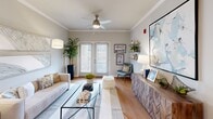 Located at 4415 Percival Rd in Columbia, SC, this single-floor, 2-bedroom, 2-bathroom residence offers a thoughtfully designed open-concept layout that maximizes both comfort and functionality. Crown molding and hardwood-style flooring flow throughout the main living areas, lending a polished, cohesive aesthetic.

The kitchen is a standout feature, boasting crisp white shaker cabinetry, stainless steel appliances, a subway tile backsplash, and a spacious central island with seating — ideal for casual dining or entertaining. Pendant lighting above the island adds a contemporary touch. Adjacent to the kitchen, a dedicated pantry provides additional storage convenience, along with a separate laundry area and utility room.

The open living and dining area is bright and inviting, with French doors that welcome natural light and ceiling fans in both the living room and bedrooms. The living space offers ample room for both dining and lounging.

Each bedroom is well-proportioned, featuring ceiling fans, large windows with natural light, and generous closet space — four closets are distributed throughout the home. The bathrooms are finished with white cabinetry, clean countertops, and a tub-shower combination. This residence also includes a pantry and multiple closets, ensuring excellent storage throughout.