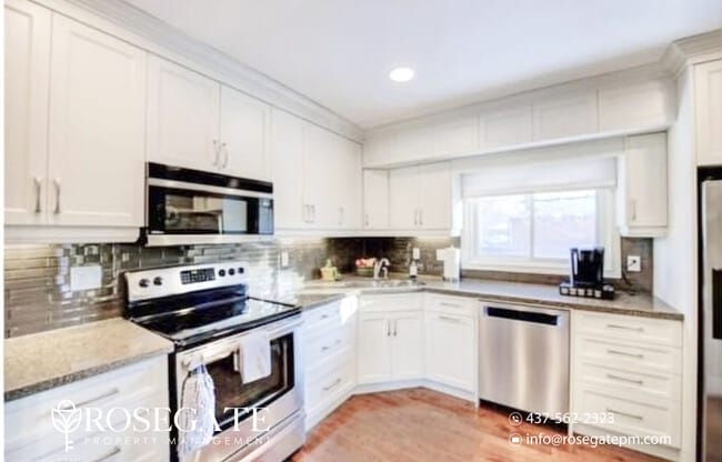 Building Photo - Massive 3-Bed Main Floor Unit with Style &...