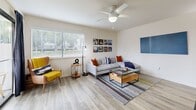 The Redwood floor plan in Citrus Heights, CA offers a well-designed single-level layout with one bedroom, one bathroom, and a thoughtfully organized collection of living spaces. Light wood-style flooring flows throughout, creating a cohesive and contemporary feel from room to room.

The welcoming hallway leads into a bright, open living room featuring a ceiling fan, a large window that invites natural light, and ample space for comfortable seating arrangements. Adjacent to the living room, the dining area provides a natural transition to the kitchen, which stands out with crisp white cabinetry, quartz-style countertops, stainless steel appliances — including a refrigerator, range, and dishwasher — and a deep single-basin sink beneath a window.

The spacious bedroom offers a serene retreat, highlighted by a distinctive decorative accent wall, a generous window with outdoor views of lush greenery, and access to two closets for abundant storage. The full bathroom features a white vanity with modern hardware, a tub/shower combination, and wood-style flooring that complements the rest of the home.

A dedicated in-unit laundry room with a full-size washer and dryer adds everyday convenience, while a private patio extends the living space outdoors. The unit is surrounded by mature trees, enhancing the sense of privacy and natural setting.