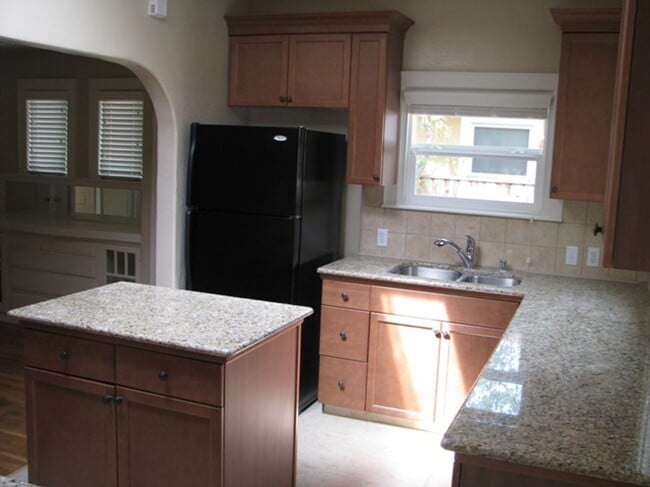 Building Photo - This Charming Spanish style home is locate...