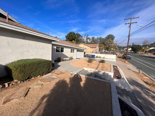 Building Photo - UPDATED 4br/2ba HOME w/ attached GARAGE in...