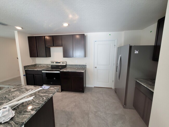 Building Photo - 12112 Lily Magnolia Ln