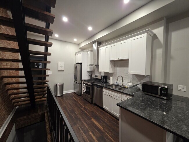 Building Photo - Chic Urban Living: Furnished 2-Bed Townhouse with Finished Basement in Pittsburgh's Strip District!