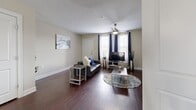 This well-designed home in San Marcos, Texas, offers a harmonious blend of comfort and functionality across its 1290 square feet. The two-story layout comprises 3 bedrooms and 4 bathrooms, with the ground floor spanning 780 square feet and the upper level 500 square feet. The primary bedroom, a generous 200 square feet, provides ample space for relaxation.

The interior showcases a modern aesthetic with neutral tones and rich wood accents. The living room features sleek hardwood flooring, complemented by a plush area rug and contemporary furniture. Large windows allow natural light to flood the space, enhancing its open and airy feel. The kitchen boasts dark wood cabinetry, stainless steel appliances, and a spacious island with seating, perfect for casual dining or entertaining.

Bedrooms are thoughtfully appointed with plush carpeting, ceiling fans, and ample natural light. Closet space is plentiful, with some rooms featuring walk-in closets. Bathrooms are well-equipped with modern fixtures, vanities, and a mix of tile and wood-look flooring.

Throughout the home, attention to detail is evident in the stylish light fixtures, coordinated color schemes, and thoughtful decor choices. The property's layout promotes easy flow between spaces, making it ideal for both everyday living and hosting gatherings. With its combination of style, space, and functionality, this San Marcos home offers a comfortable and inviting environment for its residents.