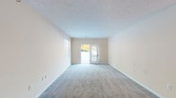 Located at 5 Poplar Ridge Rd in Alexandria, Kentucky, this single-floor home offers a well-organized, open-concept layout designed for comfortable everyday living. The spacious living area is finished with plush wall-to-wall carpeting and neutral-toned walls, creating a bright and welcoming atmosphere. Natural light flows in through windows and a glass-panel exterior door that provides access to the outdoors. A chandelier at the entry adds a classic touch to the open living and dining space.

The kitchen is thoughtfully designed with warm oak cabinetry, light countertops, a peninsula with a built-in cooktop, a double sink, white appliances including a refrigerator, electric range, and dishwasher, and recessed lighting overhead. Tile flooring grounds the kitchen and entry areas, providing a durable, easy-to-maintain surface.

The bedrooms feature soft carpeting, neutral walls, and ceiling fans for year-round comfort, with windows that bring in natural light. Closet access is conveniently included in the bedroom areas. The bathrooms are finished with tile flooring, warm wood vanities, and full tub-shower combinations, offering a clean and functional design. Throughout the home, a consistent, understated color palette and practical finishes create a cohesive and move-in ready environment.
