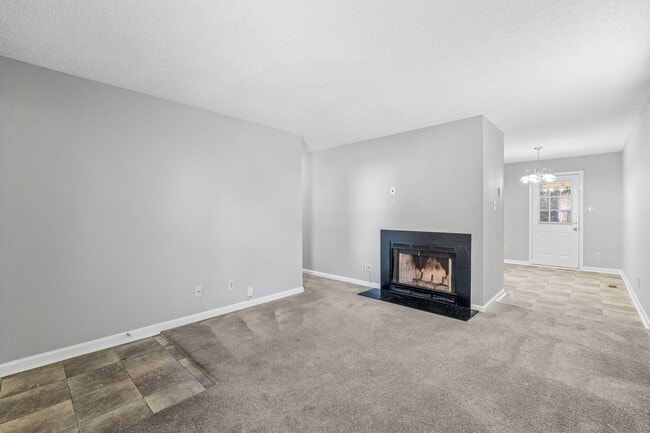 Building Photo - NE Home - Updated Kitchen and Bathrooms!  SS Appliances, Fire Place, Front Porch & Deck, Fenced Y...